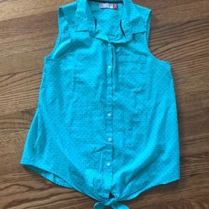 teal sleeveless top with tiny black hearts .